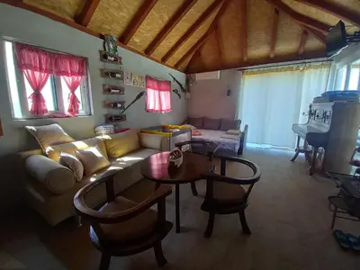 a living room with a couch and a table at Old house7 in Bar