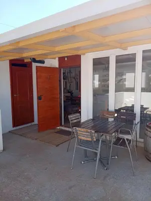 a patio with a table and chairs and a door at Old house7 in Bar