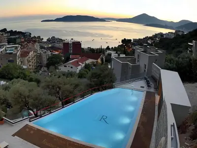 a large swimming pool on top of a building at Hotel kingStone Budva in Budva