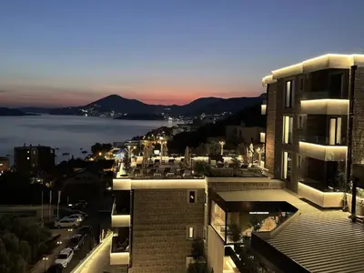 a view of a city with a view of the water at Hotel kingStone Budva in Budva