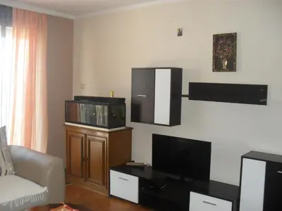 a living room with a flat screen tv and a couch at Apartment Batricevic in Ulcinj