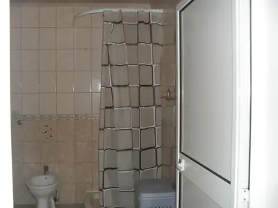 a small bathroom with a toilet and a sink at Apartment Batricevic in Ulcinj