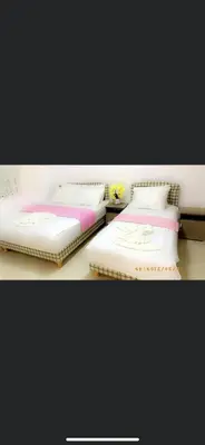 two beds sitting next to each other in a room at Babulje in Ulcinj