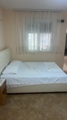 a bed in a room with a window at Babulje in Ulcinj