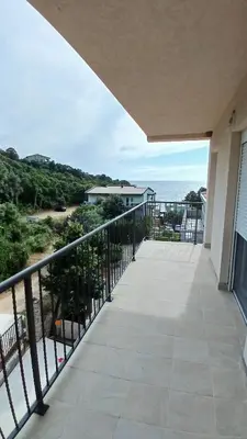a balcony with a view of the ocean at MarBis Apartmani near the sea in Utjeha