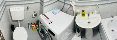 a small bathroom with a sink and a toilet at RB De lux apartment in Podgorica