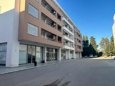 an empty street in front of a building at Smakovic Apartments in Ulcinj