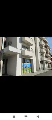 a large apartment building with a large window at Smakovic Apartments in Ulcinj