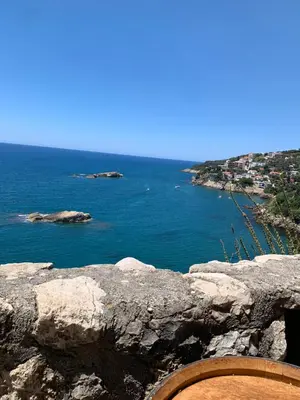 a view of the ocean from a rocky cliff at Apartments Zuto in Ulcinj