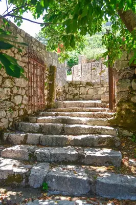 a set of stone stairs in a stone wall at Holiday Home Dapcevic in Budva