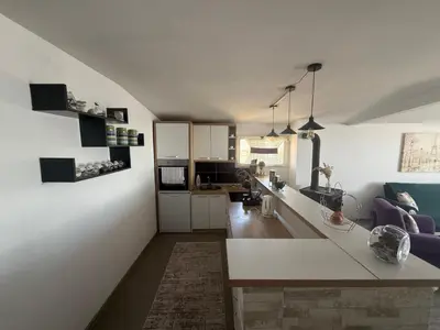 a kitchen and living room with a white counter top at Perfect VIEW in Ulcinj