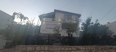 a white house with a fence in front of it at Perfect VIEW in Ulcinj