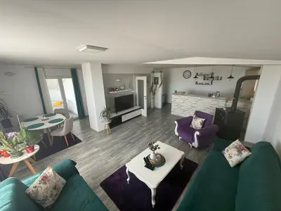 a living room with a couch and a table at Perfect VIEW in Ulcinj