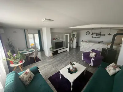 a living room with a couch and a table at Perfect VIEW in Ulcinj