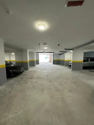 an empty parking garage with cars parked in it at Studio Apartman Dalia in Budva