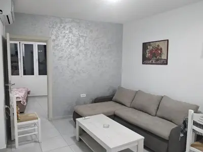 a living room with a couch and a table at Boggi Apartments in Ulcinj