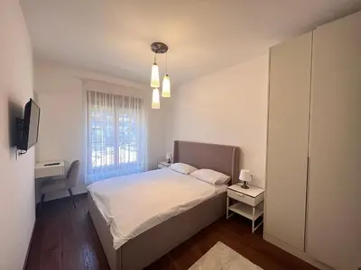 a small bedroom with a bed and a window at White Homes 1BR/APT•Master Quart in Podgorica