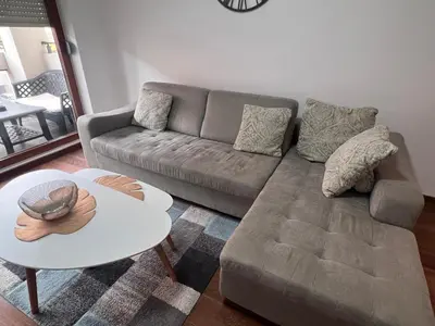 a living room with a couch and a table at White Homes 1BR/APT•Master Quart in Podgorica
