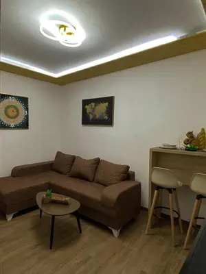 a living room with a couch and a table at Fimas Residence in Ivanovići