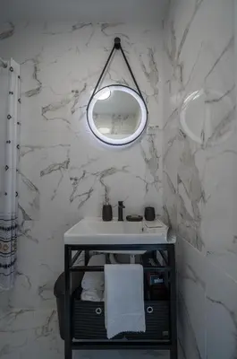 a bathroom with a sink and a mirror at Zoi apartment in Kotor