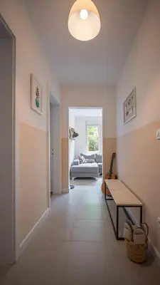 a living room with a couch and a table at Cozy apartment, 10 minutes walking distance from the Old Town in Kotor