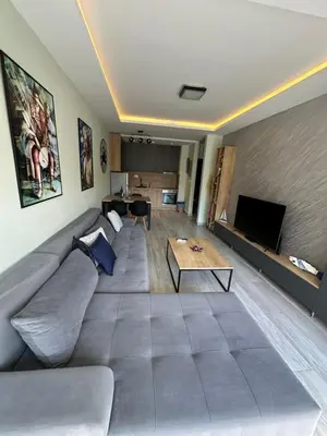 a living room with a couch and a table at eagles nest in Budva