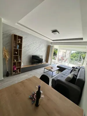 a living room with a couch and a table at eagles nest in Budva