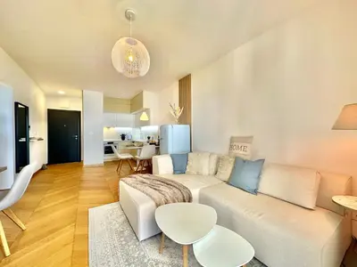 a living room with a couch and a table at Feel the Spirit Apartment in Budva