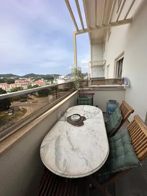 a table and chairs on a balcony with a view at Apollo 1 in Ulcinj