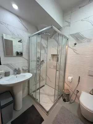 a bathroom with a shower and a sink at Apollo 1 in Ulcinj