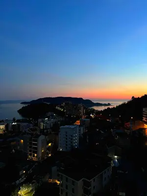 a view of a city at night at Sea & Sky Apartments in Budva