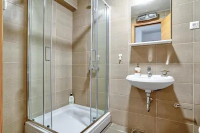 a bathroom with a sink and a shower at Sigma apartment in Budva