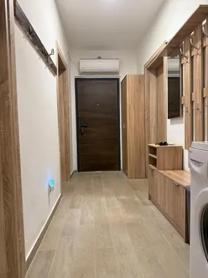 a bathroom with a hallway with a door and a sink at Summer house Kruce in Kruče