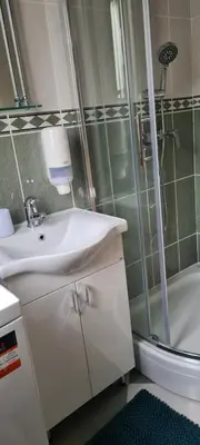 a bathroom with a sink and a shower at Apartman Petar in Budva