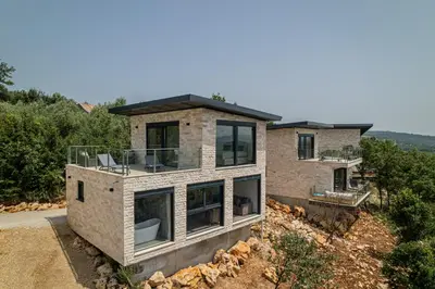 a house on top of a hill at Solana's View - Ferienhäuser in ruhiger Lage, mit einer einzigartigen Aussicht, Infinity Pool, Free Parking und Wlan in Ulcinj