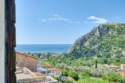 a view of the ocean from a building at Eva's country house in Buljarica