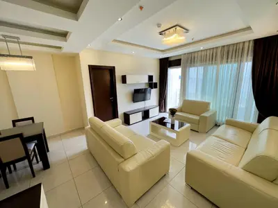 a living room with two couches and a dining room at BigMontenegro Shine in Budva