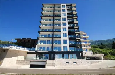 a large white building with balconies on top of it at BigMontenegro Shine in Budva