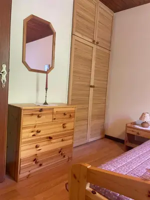 a bedroom with a dresser with a mirror on it at DOLCE NOTTE rooms in Virpazar