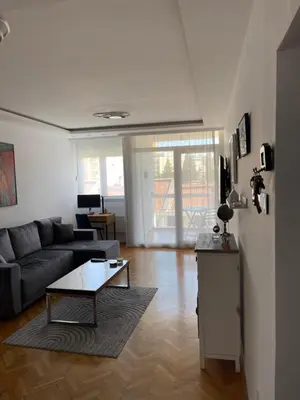 a living room with a couch and a coffee table at Apartment Ritter in Budva