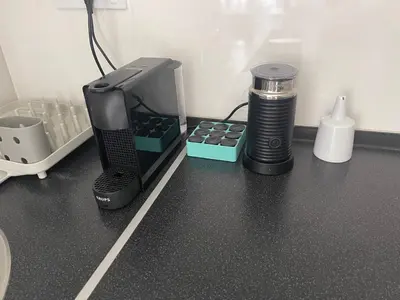 a desk with a computer printer and a coffee maker at Apartment Ritter in Budva