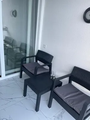 two chairs and a table in a room at Apartment Ritter in Budva