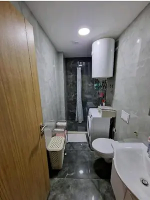 a bathroom with a toilet and a sink at The sun is happiness in Ulcinj
