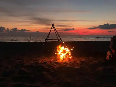 a bonfire on the beach at sunset at The sun is happiness in Ulcinj