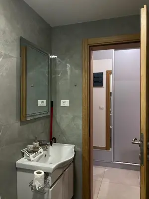 a bathroom with a sink and a mirror at The sun is happiness in Ulcinj