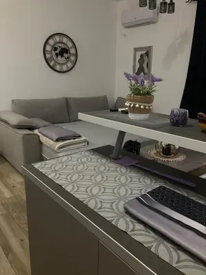 a living room with a couch and a table at The sun is happiness in Ulcinj