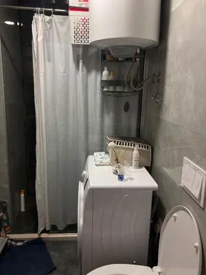 a small bathroom with a toilet and a shower at The sun is happiness in Ulcinj