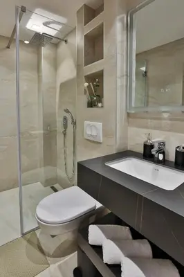 a bathroom with a toilet and a sink and a shower at Villa La Vida in Budva