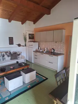 a kitchen with white cabinets and a white refrigerator at Apartman Boljević in Podgorica