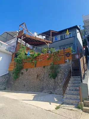 a building with stairs leading up to a building at Carefree Apartments in Ulcinj